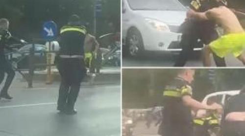 EXCLUSIV. Noi imagini cu intervenţia comică a celor 5 poliţişti cu bărbatul în şort, filmate de un şofer
