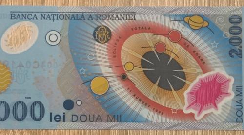 Cât se oferă acum pe bancnota de 2.000 de lei cu eclipsa din 1999. Unele exemplare ajung la sume colosale