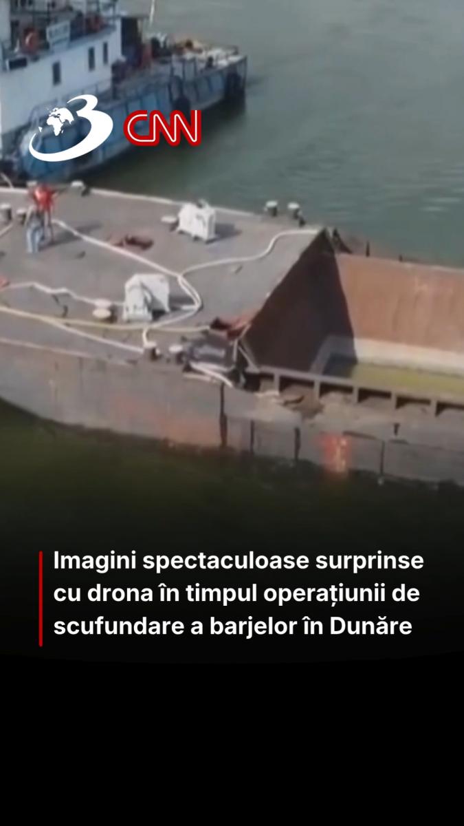 Imagini spectaculoase surprinse cu drona în timpul operațiunii de scufundare a barjelor în Dunăre