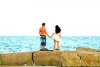 Iubirea în fotografii: Un tânăr a fost surprins în timp ce îşi cerea iubita în căsătorie pe malul mării 106469