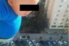 Și-a scos copilul pe geam, la etajul 15, ţinându-l de tricou, pentru a primi „like-uri“ pe Facebook - FOTO 458203